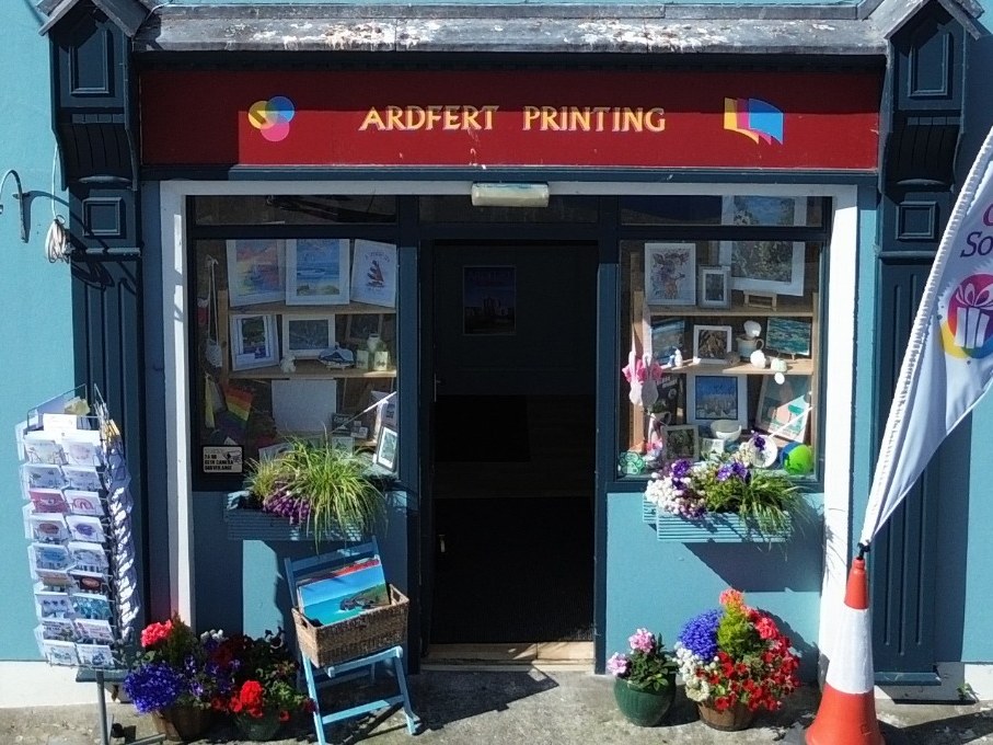 Window display of framed Kerry prints, cards and local gifts at Ardfert Printing